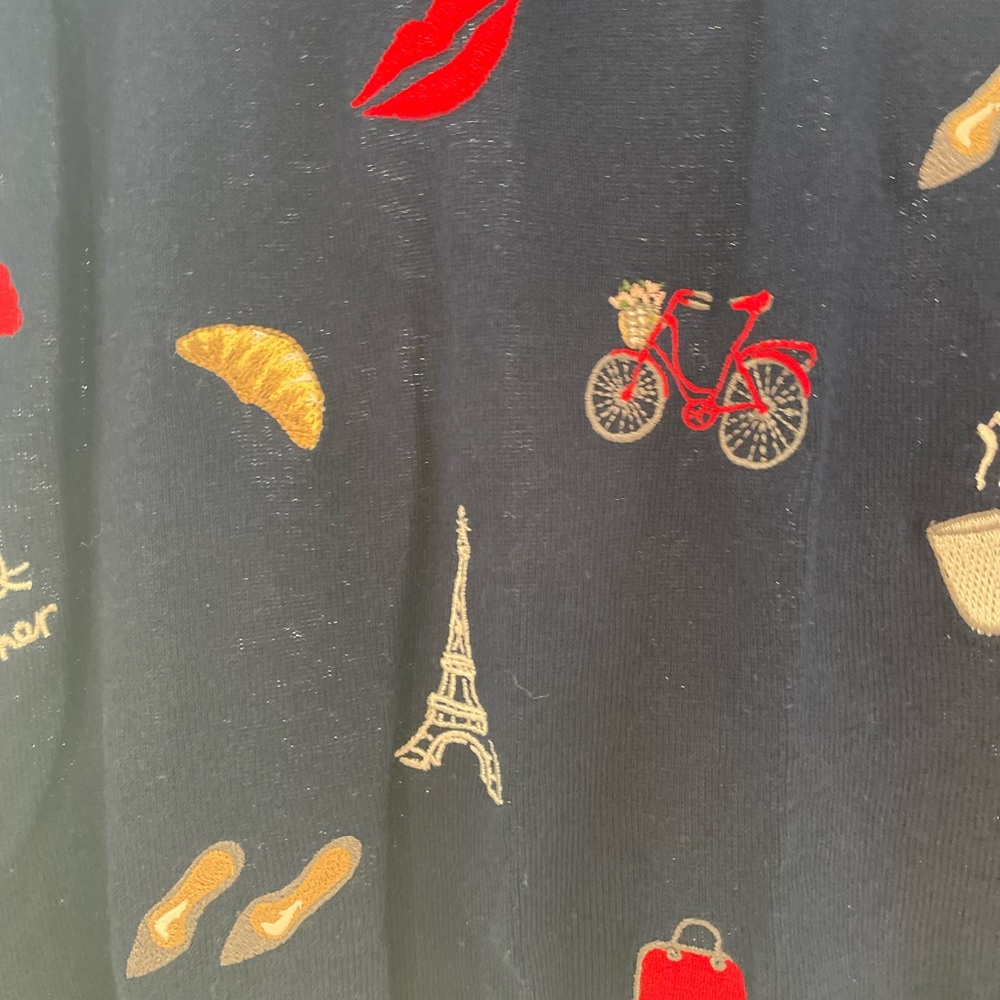 Navy blue long sleeve lightweight sweater with French theme.